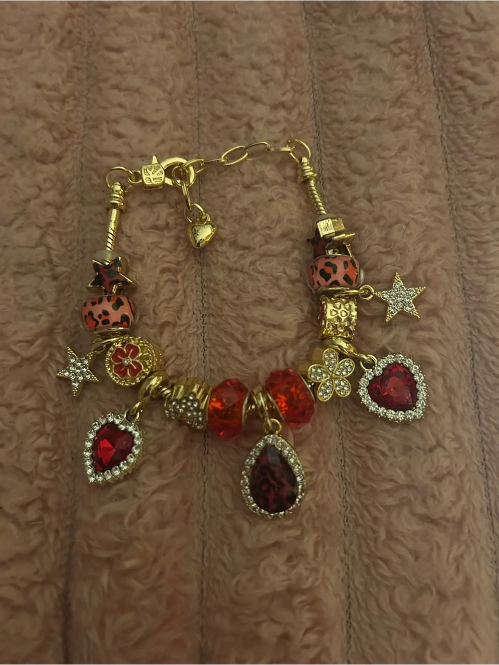 Gold-Tone Red Crystal Charm Bracelet with Heart, Star and Floral Charms